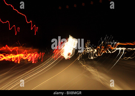 Abstract moving shot of car lights on the road Stock Photo