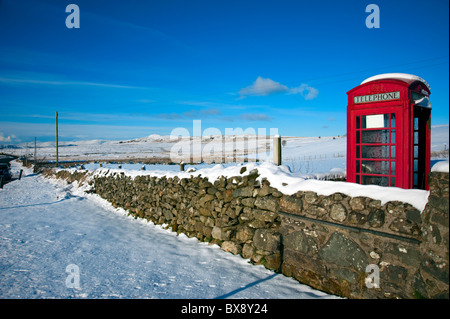 Phone box in the snow Stock Photo