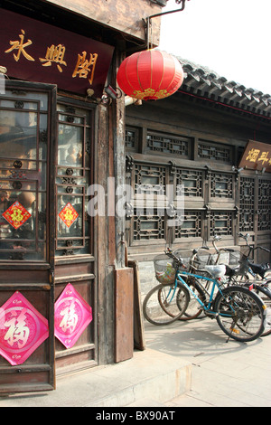 A street scene with bicycles in the old section of Beijing, China Stock Photo