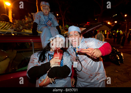 A family dressed as ghoulish doctors in the 2010 Greenwich Village Halloween parade in New York City Stock Photo