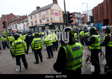 A phalanx of police officers, numbering in excess of 1,400, equipped with riot gear and security dogs, kept a rally of 1,000 Stock Photo