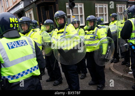 A phalanx of police officers, numbering in excess of 1,400, equipped with riot gear and security dogs, kept a rally of 1,000 Stock Photo