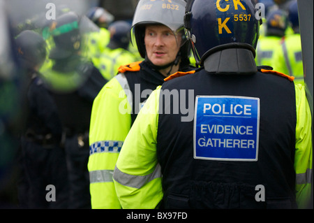 A phalanx of police officers, numbering in excess of 1,400, equipped with riot gear and security dogs, kept a rally of 1,000 Stock Photo