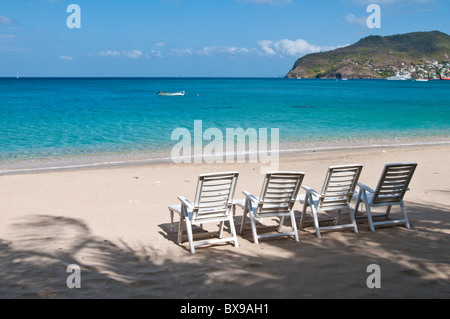 Beach chairs on Lower Bay beach, Bequia, St. Vincent & The Grenadines. Stock Photo