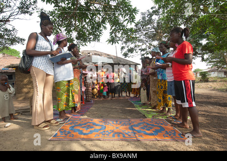 Women attend a community microfinance meeting in Kakata, Liberia, West Africa. Stock Photo