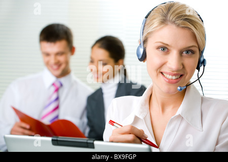 Portrait of representative operator with charming smile Stock Photo