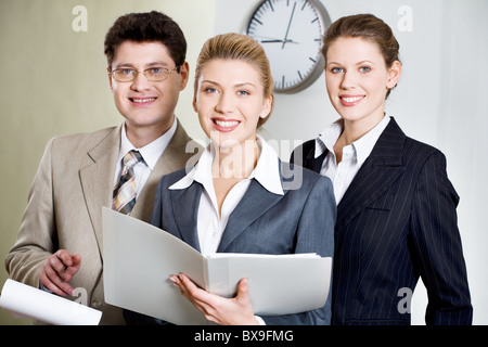Portrait of three smiling businesspeople looking at camera Stock Photo