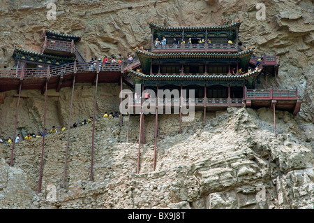 Tourists visiting the Buddhist Hanging Temple Monastery on the side of Mount Heng in Shanxi, China. Stock Photo