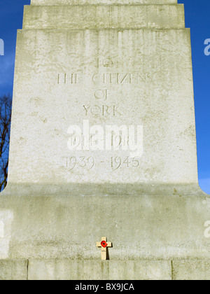 Close up of single Remembrance Day red poppy on the City War Memorial York North Yorkshire England UK United Kingdom GB Great Britain Stock Photo