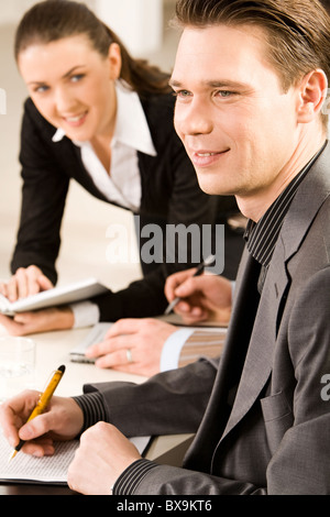 Portrait of thoughtful business man sitting at the table Stock Photo