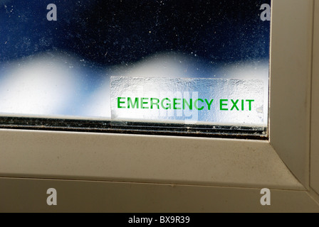 emergency exit sticker attached to double glazed window england uk Stock Photo