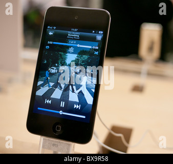 An ipod on display in the Apple Store playing Abbey Road by the Beatles Stock Photo