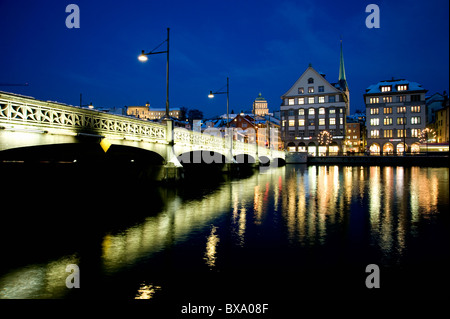 Illuminated Rudolf-Brun-Brücke, Rudolf-Brun-Bridge, over the river Limmat in Zurich by night, Switzerland. Stock Photo