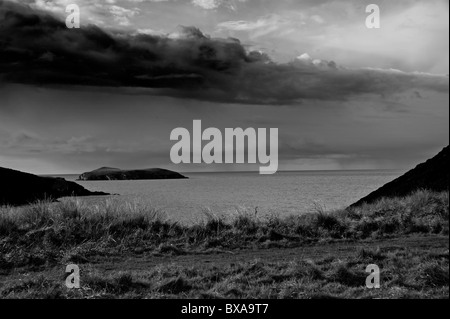 This view  is looking west from outside the Mwnt  church, in the distance you can see Cardigan Island. Stock Photo