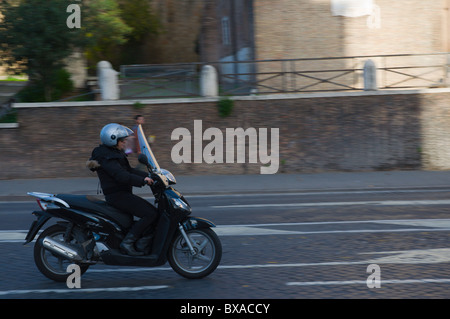 Woman driving a scooter Rome Italy Stock Photo - Alamy