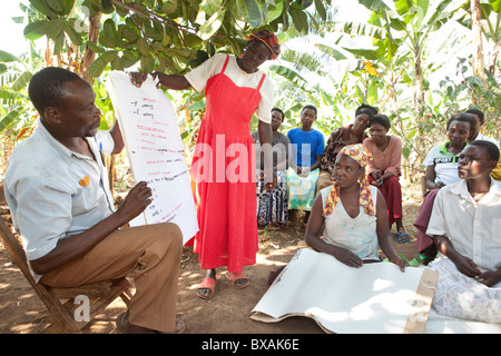 Villagers attend a community meeting in Buwanyanga Village - Sironko, Eastern Uganda, East Africa. Stock Photo