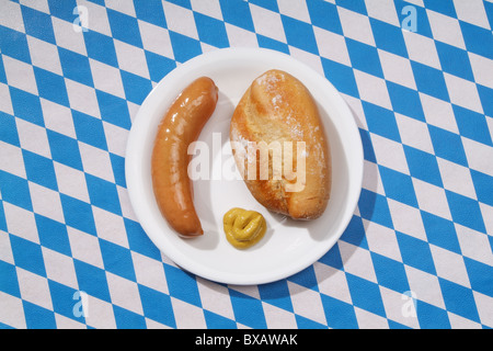 A sausage with mustard and a bun Stock Photo