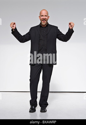 Man laughing against white background Stock Photo