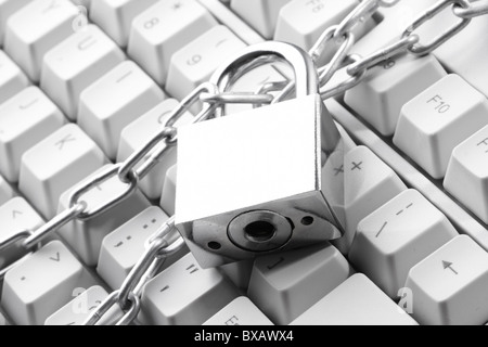 Computer keyboard secured with chain and padlock Stock Photo