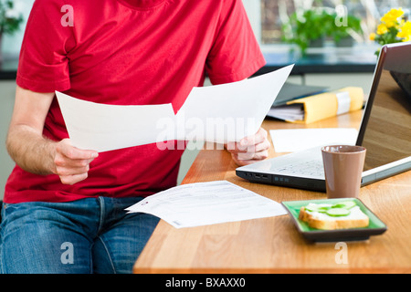 Mid section of man working from home Stock Photo