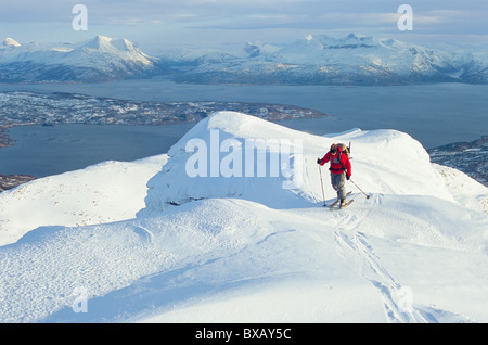 Person telemark skiing in mountain scenery Stock Photo