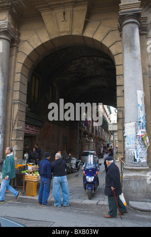 Traffic at gate to Ballarmo market central Palermo Sicily Italy Europe Stock Photo