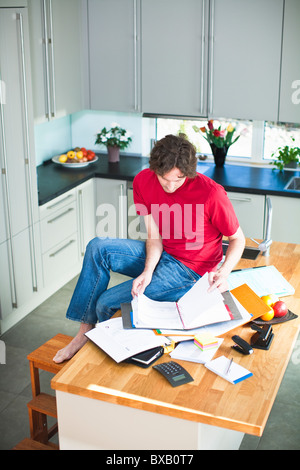 Mid adult man working from home Stock Photo
