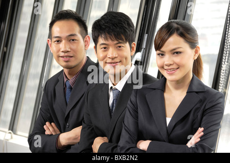 Business executives standing in a row in an office Stock Photo