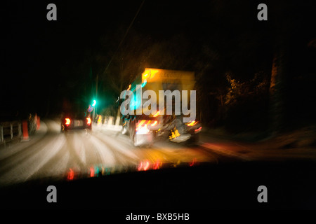 Snowplow on snowy road Stock Photo