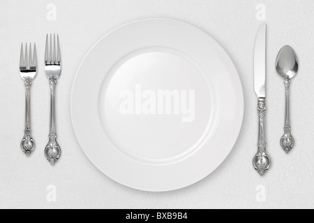 White Place Setting on tablecloth. Stock Photo