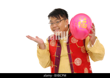 Man holding a balloon and smiling Stock Photo