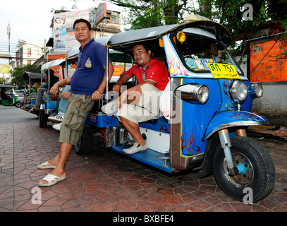 Tuk tuk taxi driver, Bangkok, Thailand, Asia Stock Photo