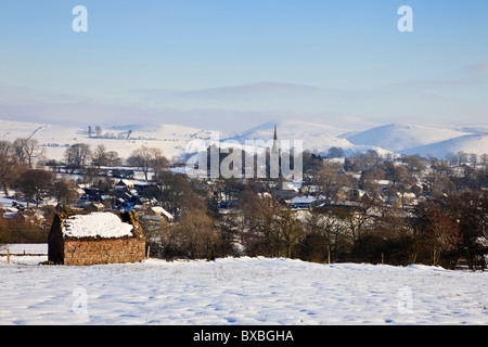 View to village across snowy landscape in the Peak District National Park. Butterton, Staffordshire, England, UK, Britain Stock Photo