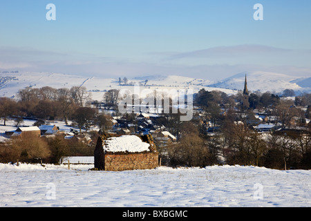 Butterton, Staffordshire, England, UK, Europe. View to village across snowy landscape in the Peak District National Park Stock Photo