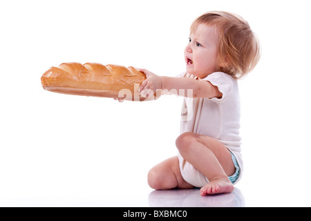 Baby giving out a loaf of bread isolated on white Stock Photo