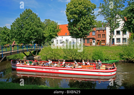 excursion boat in a canal, Friedrichstadt, North Friesland, North Sea Coast, Schleswig-Holstein, Northern Germany Stock Photo