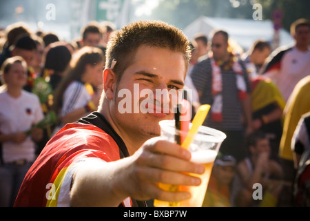 Cheers! A football fan during the final of the European Championship, Berlin, Germany Stock Photo