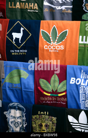 T-shirts with coca leaves in form of Adidas logo and Che Guevara for sale outside shop in tourist market, Calle Linares, La Paz, Bolivia Stock Photo
