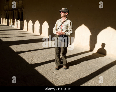 Pilgrim and shadows at church on Camino de Santiago Stock Photo
