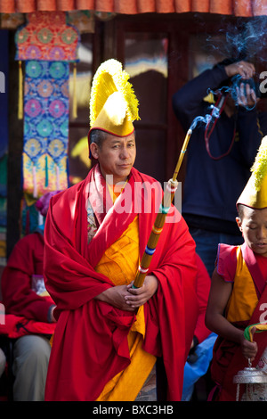 Buddhist monk holding an incense stick Stock Photo - Alamy