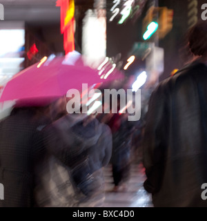 People walking with umbrellas on the streets of Manhattan, New York City, U.S.A. Stock Photo