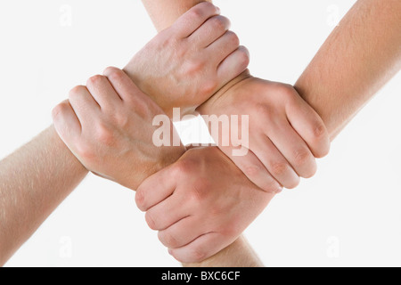 Conceptual image of crossed hands isolated over white background Stock Photo