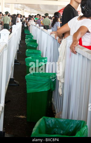 green garbage cans in the middle of a queue to a Shanghai Expo pavillion Stock Photo