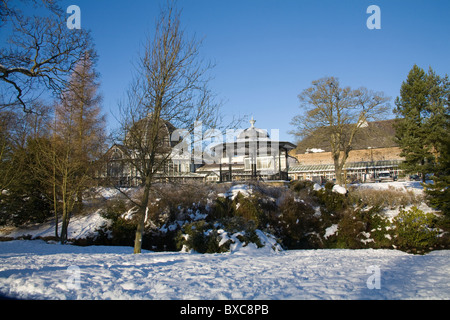 Buxton Derbyshire England December The Band stand across snow covered Pavilion Gardens Stock Photo