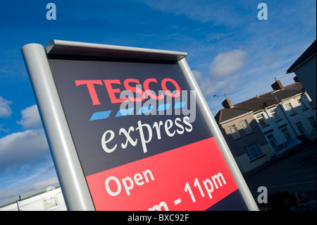 Roadside advertising sign for Tesco express outside store Stock Photo