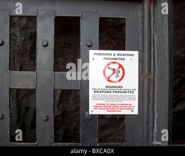 Carlsbad, New Mexico - A sign prohibits firearms and weapons in Slaughter Canyon Cave in Carlsbad Caverns National Park. Stock Photo