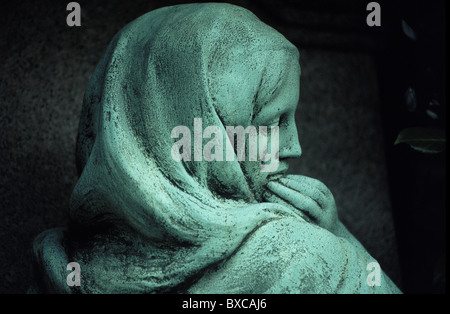 Bronze figure of young woman crying in Hampstead Cemetery Stock Photo