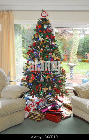 Christmas tree, presents, and decorations in an American home Stock