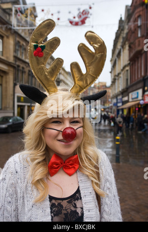 Charity fundraiser, high school pupil in festive costume collecting in Newport City centre South Wales UK Stock Photo