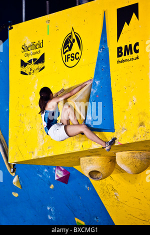 Japanese woman climbing rock wall Stock Photo - Alamy